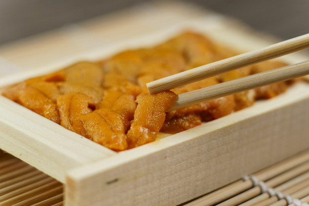 sea urchin with chopsticks